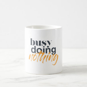 Modern, trendy, urban design of Busy Doing Nothing Coffee Mug