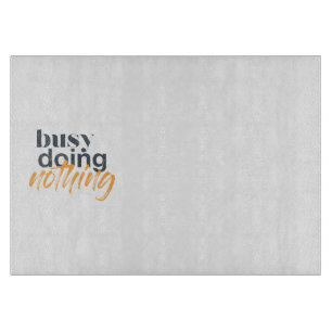 Modern, trendy, urban design of Busy Doing Nothing Cutting Board