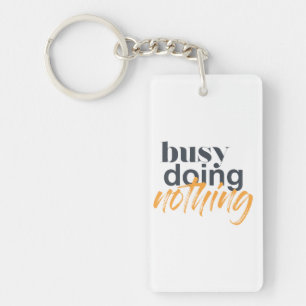 Modern, trendy, urban design of Busy Doing Nothing Key Ring
