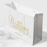 Modern White and Gold Personalised Bridesmaids Large Gift Bag<br><div class="desc">Modern White and Gold Personalised Bridesmaids Gifts featuring personalised bridesmaid's name in gold modern script font style with title and wedding date in gold modern sans serif font style. Also perfect for Maid of Honour, Flower Girl, Mother of the Bride and more. Please Note: The foil details are simulated in...</div>