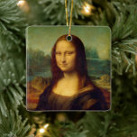 Mona Lisa | Leonardo da Vinci Ceramic Ornament<br><div class="desc">Mona Lisa (1503-1506) by Italian Renaissance artist Leonardo da Vinci. The original work is oil on poplar wood panel. This famous painting is thought to be a portrait of Lisa Gherardini, and has been acclaimed as "the best known, the most visited, the most written about, the most sung about, the...</div>