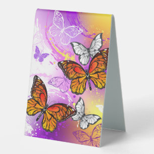 Monarch Butterflies on Purple Background