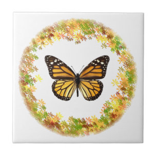 Monarch butterfly in frame of leaves ceramic tile