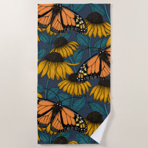 Monarch butterfly on yellow coneflowers beach towel