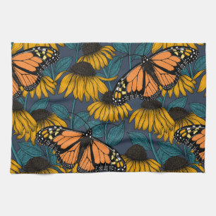 Monarch butterfly on yellow coneflowers tea towel
