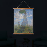 Monet's Woman with Parasol,Impressionist Landscape Hanging Tapestry<br><div class="desc">Claude Monet's Woman with a Parasol was painted in 1875 and is one of his iconic impressionist masterpieces. The painting depicts Madame Monet and her son, captured in a windy outdoor setting. The woman is holding a parasol, and the child stands beside her. The scene is set against a vibrant...</div>