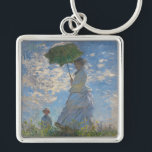 Monet's Woman with Parasol,Impressionist Landscape Key Ring<br><div class="desc">Claude Monet's Woman with a Parasol was painted in 1875 and is one of his iconic impressionist masterpieces. The painting depicts Madame Monet and her son, captured in a windy outdoor setting. The woman is holding a parasol, and the child stands beside her. The scene is set against a vibrant...</div>