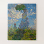 Monet's Woman with Parasol Jigsaw Puzzle<br><div class="desc">Woman with Parasol was painted by impressionist painter Claude Monet in 1875.  The painting is of Madame Monet and her son. This classic masterpiece is filled with light and softness in pastel and bright shades of blue and green.</div>