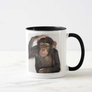 Monkey scratching its head mug