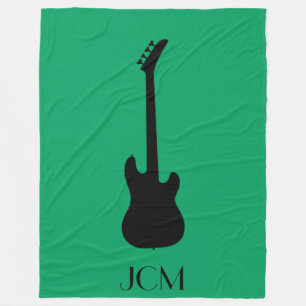 Monogram Black Electric Bass Guitar on Green Fleece Blanket