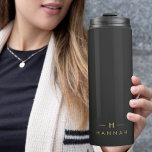 Monogram Black Gold | Modern Minimalist Elegant Thermal Tumbler<br><div class="desc">A simple stylish custom monogram design in a gold modern minimalist typography on an off black background. The monogram initials and name can easily be personalized along with the feature line to make a design as unique as you are! The perfect bespoke gift or accessory for any occasion.</div>