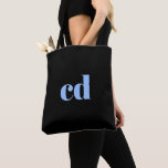Monogram black light blue initials elegant modern tote bag<br><div class="desc">A classic chic black background. Personalise and add your monogram initials written with light blue block letters. Modern,  trendy and simple.</div>