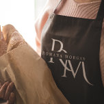 Monogram Black Personalised Apron<br><div class="desc">Cook in style with this Monogram Black Personalised Apron. Featuring a sleek black design and a customisable monogram, this apron adds a touch of sophistication to any kitchen. Made from durable and high-quality materials, it provides both comfort and protection, making it perfect for both amateur and professional chefs. Whether you're...</div>