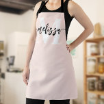 Monogram Brush Calligraphy Blush Pink Apron<br><div class="desc">In the realm of culinary arts, individuality and style are as significant as the flavours you create. Our personalised apron, adorned with a tastefully designed monogram and your name, serves as an emblem of your unique culinary identity. The font duo—comprising an elegant serif font for the monogram and a modern...</div>
