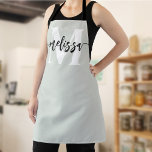 Monogram Brush Calligraphy Sage Green Apron<br><div class="desc">In the realm of culinary arts, individuality and style are as significant as the flavours you create. Our personalised apron, adorned with a tastefully designed monogram and your name, serves as an emblem of your unique culinary identity. The font duo—comprising an elegant serif font for the monogram and a modern...</div>