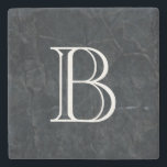 Monogram Elegant Black Stone Texture Stone Coaster<br><div class="desc">An elegant looking black marbled stone texture. Cuts,  scrapes,  scarring and random marks give it depth and personality. Personalise with your initial / monogram in a bold white font.</div>