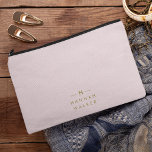 Monogram Elegant Minimal Blush Pink and Gold Accessory Pouch<br><div class="desc">A simple stylish custom monogram design in a gold modern minimalist typography on an elegant pastel blush pink background. The monogram initials and name can easily be personalised along with the feature line to make a design as unique as you are! The perfect bespoke gift or accessory for any occasion....</div>