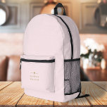 Monogram Elegant Minimal Blush Pink and Gold Printed Backpack<br><div class="desc">A simple stylish custom monogram design in a gold modern minimalist typography on an elegant pastel blush pink background. The monogram initials and name can easily be personalised along with the feature line to make a design as unique as you are! The perfect bespoke gift or accessory for any occasion....</div>