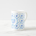 Monogram Hanukkah Festival Menorah Lights Bone China Mug<br><div class="desc">Hanukkah Menorah Lights Holiday label. Monogram and Hanukkah Logo Decoration with traditional symbols pattern. Home & Living > Kitchen & Dining > Drinkware > Mugs & Cups. Israel,  Jerusalem. Sofiartmedia Modern Design.
Judaica Modern Design with text template. Personalise them by adding name or wishes text.</div>