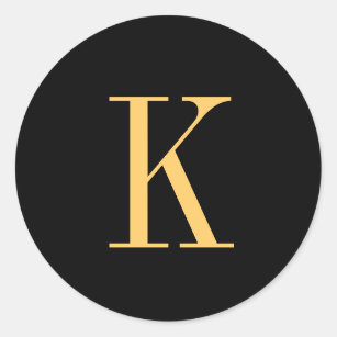 Monogram K gold-coloured on black background Classic Round Sticker