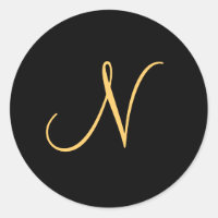 Monogram N, gold coloured initial N on black,