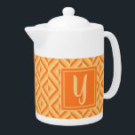 Monogram Orange Three-Tone Diamond Pattern<br><div class="desc">Make your tea in this Monogram Orange Three-Tone Diamond Pattern Teapot. It features a geometric diamond pattern in three shades of orange with an initial in light orange against a dark orange square. Personalise it with your initial. Give your teatime an extra pop of colour.</div>