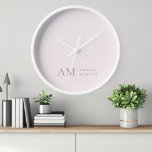 Monogram Personalised Pink Initial And Name  Clock<br><div class="desc">Add a touch of elegance to your space with our Minimalistic Monogram Personalised Pastel Pink Wall Clock. Featuring a soft pastel pink background, this sophisticated clock is adorned with a sleek monogram initial and your custom name in a modern font. Perfect for any room in your home or office, this...</div>