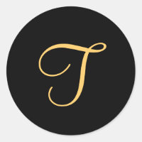 Monogram T, gold coloured initial T on black,
