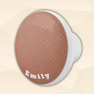 Monogram white arrow on mocha mousse background   ceramic knob