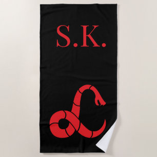 Monogrammed beach towel with snake logo design