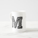 Monogrammed Mug: Letter "M" Bone China Mug<br><div class="desc">Monogrammed mug featuring the letter “M” in black.</div>