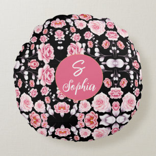 Monogrammed pink floral pattern on black round cushion