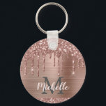 Monogrammed Rose Gold Glitter Drips on Pink Metal Key Ring<br><div class="desc">Modern, girly rose gold glitter drips name and monogrammed keychain.This design features blush pink rose gold glitter sparkle drips on pink brushed metal background with custom personalised monogram initial and first name text template. Perfect feminine gift. Please note, this design is printed photo effect. If you need help or matching...</div>