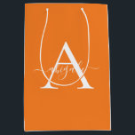 Monogrammed Tangerine Orange | Minimalist Elegant Medium Gift Bag<br><div class="desc">Introducing our stylish custom monogram design, featuring a modern and minimalist white typography set against a Tangerine orange background. This sophisticated design is fully customisable with your own monogram initials, and script name, making it as unique as you are! Whether you're looking for the perfect bespoke gift or a chic...</div>