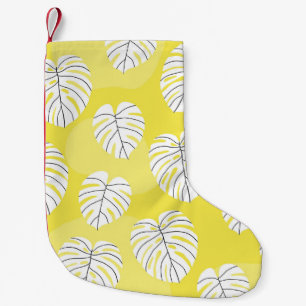 Monstera leaves, bright yellow background. small christmas stocking