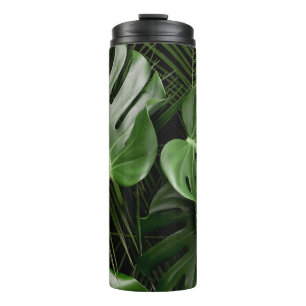 Monstera leaves, luxury tropical layout. thermal tumbler