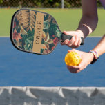 Moody Romantic Tropical Gold Floral Pickleball Paddle<br><div class="desc">A beautifully designed custom Moody Romantic Tropical Gold Floral pickleball paddle makes for an exceptional gift, whether you're treating yourself or surprising someone special. Perfect for pickleball enthusiasts of all levels, this paddle combines functionality with style, offering a high-quality performance tool that's as visually striking as it is practical. The...</div>