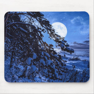 Moon over snowy fir tree and sea coast at night mouse pad
