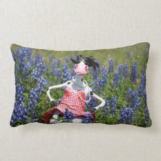 Mootilda the cow roams in the bluebonnets. lumbar cushion