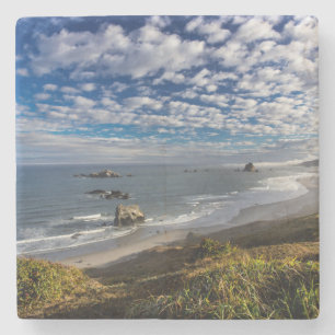 Morning clouds and fog at the beach stone coaster