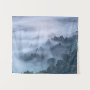 Morning fog rolling through trees tapestry