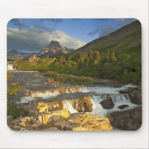 Morning light greets Swiftcurrent Falls in the Mouse Pad