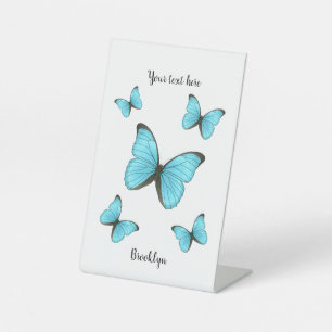 Morpho butterflies cartoon illustration pedestal sign