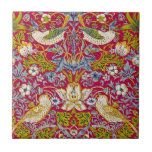 Morris Red Background Strawberry Thief Pattern Ceramic Tile<br><div class="desc">"Strawberry Thief" is a textile design created by the British designer William Morris in 1883. The work features an intricate pattern of strawberries, flowers, and birds, primarily the thrushes that seem to be stealing the strawberries. The lush, naturalistic forms are arranged in a harmonious, repeating pattern that showcases Morris's love...</div>