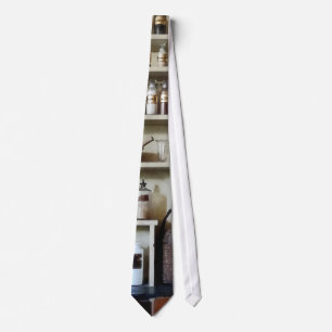 Mortar and Pestle and Bottles on Shelves Tie