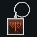 Moshe's Menorah Key Ring<br><div class="desc">In the Torah Moshe Rabbenu is told, "You shall make a Menorah of pure gold, beaten out, shall the Menorah be made, its base, its branch, its goblets, its knobs, and its flowers shall be hammered from it, " [Shmot 25:31] and later, "See, and construct, according to their form that...</div>