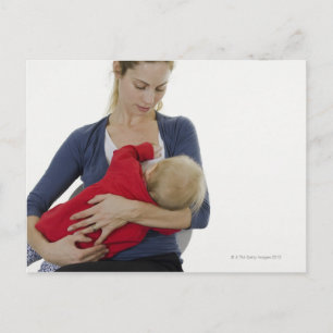 Mother breastfeeding her baby. postcard