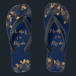 Mother of the Bride Gold Foliage Navy Blue Thongs<br><div class="desc">These gorgeous Mother of the Bride gold foliage navy blue flip flops have a dark blue background that is adorned with an intricate gold floral greenery pattern and customisable modern typography. The combination of the rich navy and the shimmering gold create an elegant and luxurious aesthetic. It's a beautiful gift...</div>