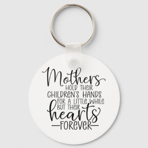 Mothers hold their children’s hand for a little wh key ring