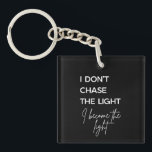 Motivational Quote Black Background Key Ring<br><div class="desc">Clean,  bold,  and quietly powerful. This minimalist typography design features the quote “I Don’t Chase the Light,  I Become the Light, ” blending strong modern lettering with an elegant script accent. It’s made for anyone focused on growth,  confidence,  and self-leadership rather than chasing validation.</div>